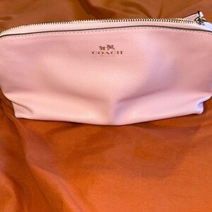 Coach Pink Cosmetic Bag with Streamlined Design